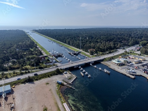 a city with several boats in the water and many trees on it: Sweden, Malmo, Ales stenar