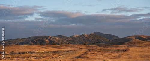 Sunrise on an empty valley amazing hilly landscape. Colorful grassy and hilly natural landscape in autumn. Beautiful autumn scenery in Inner Mongolia, China.