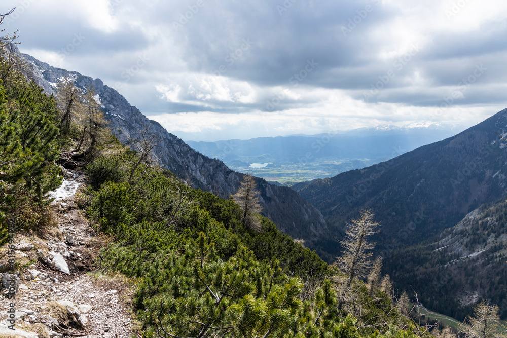 Begunjščica panorama of mountain trekking to the highest peak. View of the Alps, climbing with via ferrata. Distant view of Lake Bled from above. Sports holidays, life of adventure in the countryside Begunjščica panorama of mountain trekking to the highest peak. View of the Alps, climbing with via ferrata. Distant view of Lake Bled from above. Sports holidays, life of adventure in the countryside