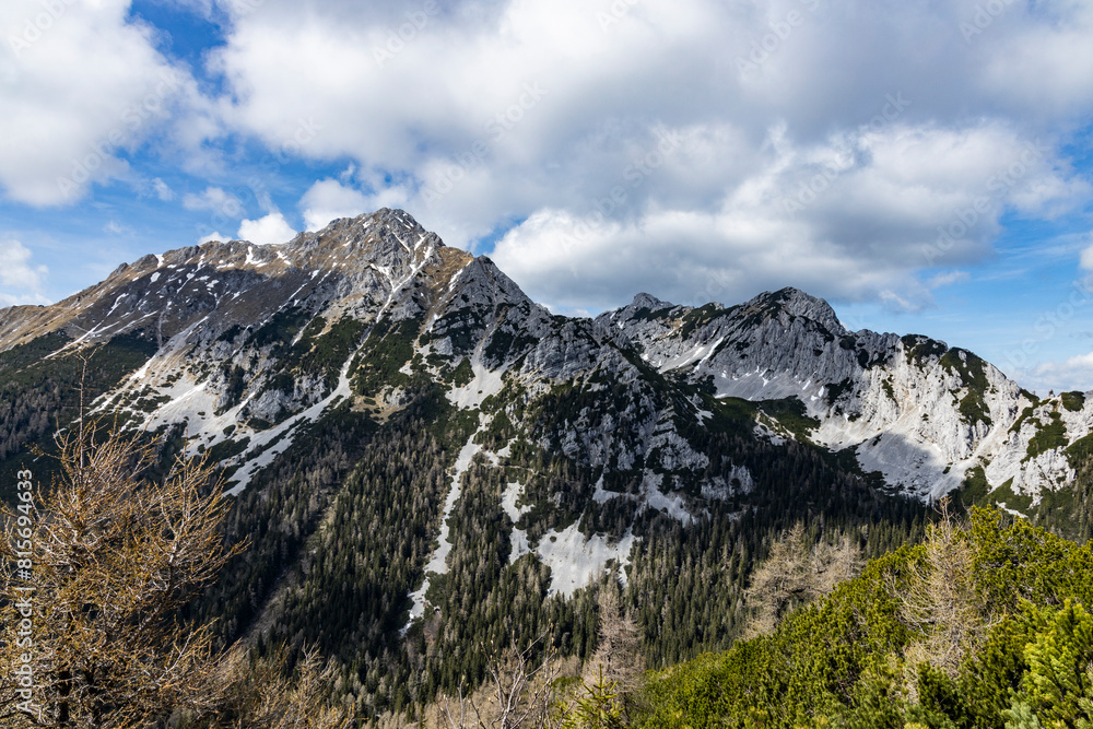 Begunjščica panorama of mountain trekking to the highest peak. View of the Alps, climbing with via ferrata. Distant view of Lake Bled from above. Sports holidays, life of adventure in the countryside Begunjščica panorama of mountain trekking to the highest peak. View of the Alps, climbing with via ferrata. Distant view of Lake Bled from above. Sports holidays, life of adventure in the countryside