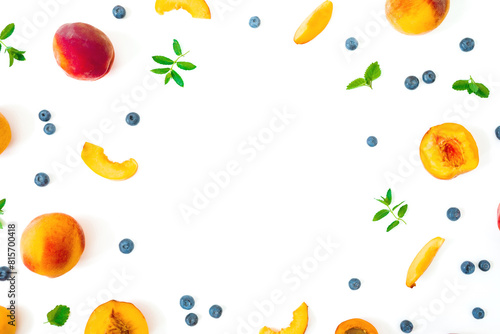 Fototapeta Naklejka Na Ścianę i Meble -  Peaches with blueberry and mint leaves on white background. Summer concept. Flat lay