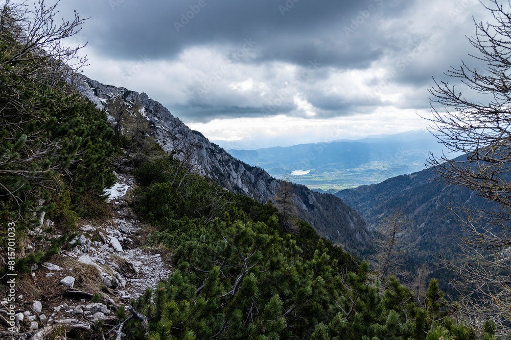 Begunjščica panorama of mountain trekking to the highest peak. View of the Alps, climbing with via ferrata. Distant view of Lake Bled from above. Sports holidays, life of adventure in the countryside Begunjščica panorama of mountain trekking to the highest peak. View of the Alps, climbing with via ferrata. Distant view of Lake Bled from above. Sports holidays, life of adventure in the countryside