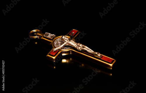 High angle shot of a crucifix on a black background