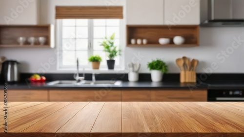 Wood table top on blur kitchen counter  room background.