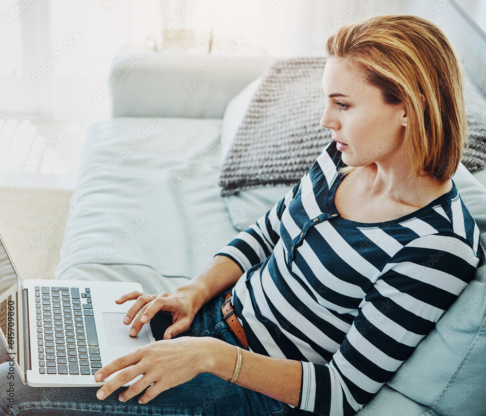 Woman, laptop and home with typing for remote work in startup, career with reading on couch. Female person, graphic designer and computer with research for creative, plan for website development Woman, laptop and home with typing for remote work in startup, career with reading on couch. Female person, graphic designer and computer with research for creative, plan for website development