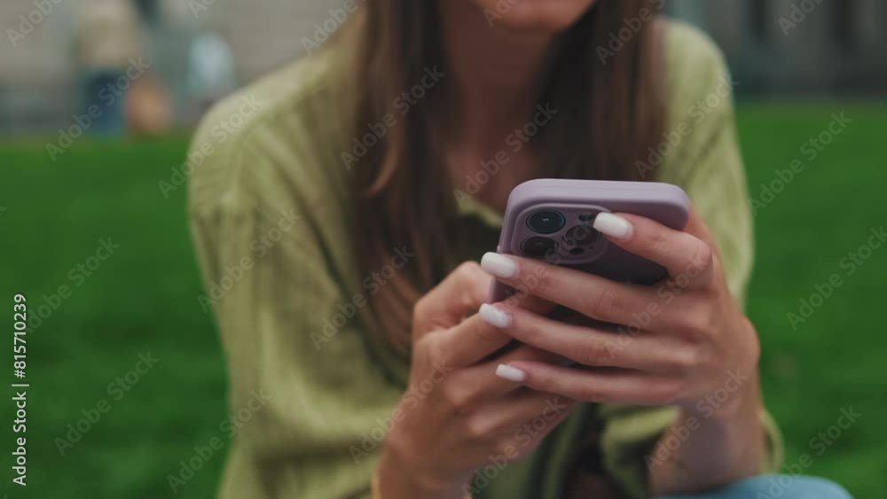 Close-up of hands of an unrecognizable woman holding a mobile phone