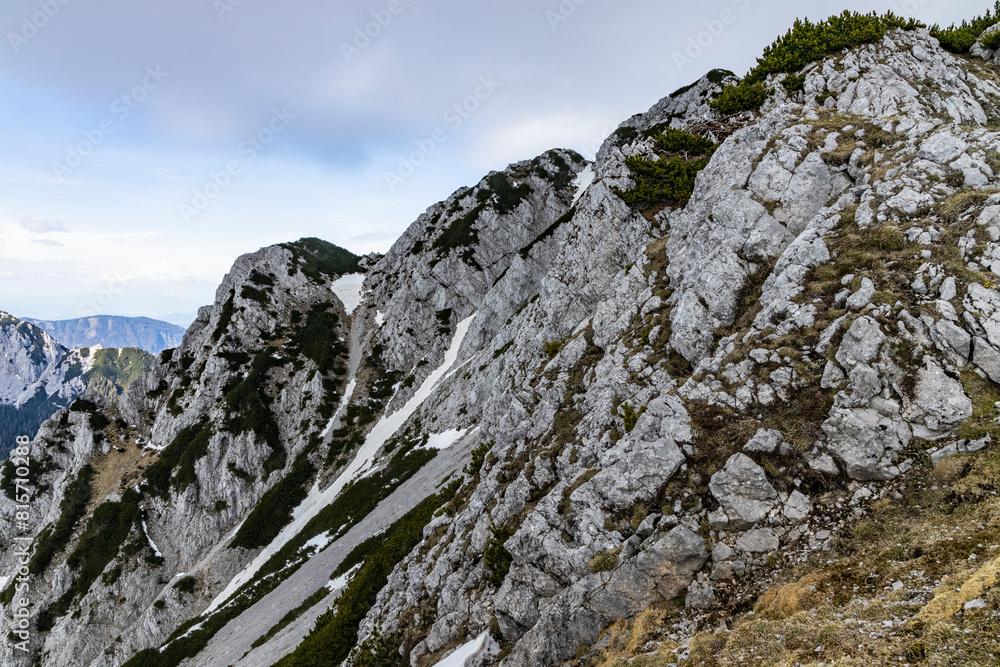 Begunjščica panorama of mountain trekking to the highest peak. View of the Alps, climbing with via ferrata. Distant view of Lake Bled from above. Sports holidays, life of adventure in the countryside Begunjščica panorama of mountain trekking to the highest peak. View of the Alps, climbing with via ferrata. Distant view of Lake Bled from above. Sports holidays, life of adventure in the countryside