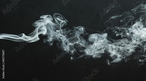 A ghostly white smoke curling against a pitch-black background, creating a stark contrast