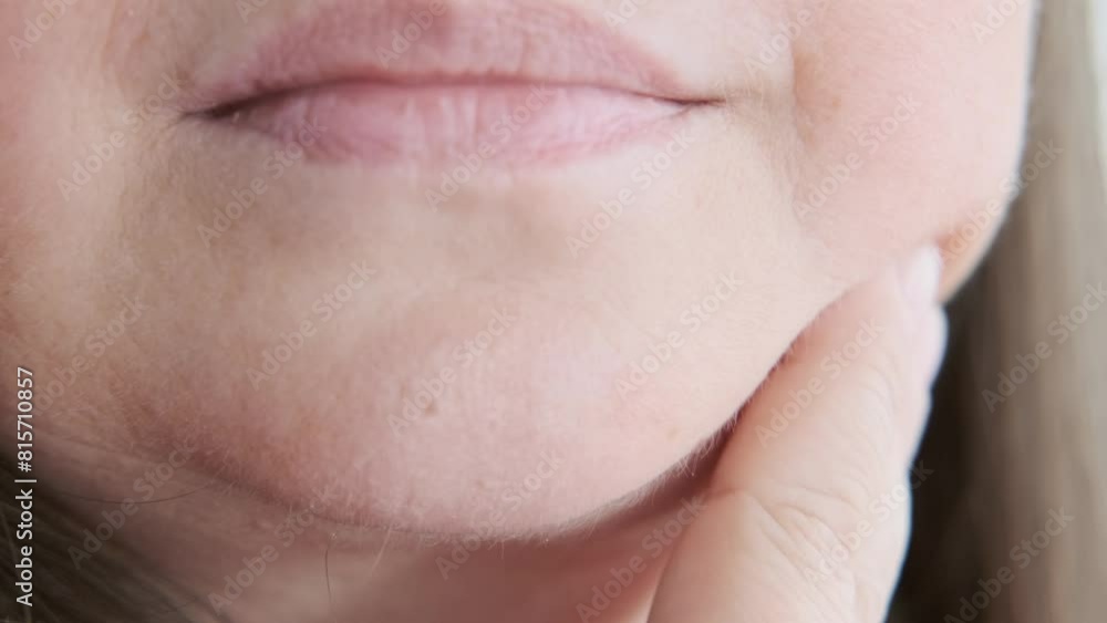 close-up Female face with Jowls, double chin, Skin sagging, Volume reduction, mature woman 50 years old, wrinkles skin, aging natural process, aesthetic injection cosmetology, anti-aging procedures close-up Female face with Jowls, double chin, Skin sagging, Volume reduction, mature woman 50 years old, wrinkles skin, aging natural process, aesthetic injection cosmetology, anti-aging procedures