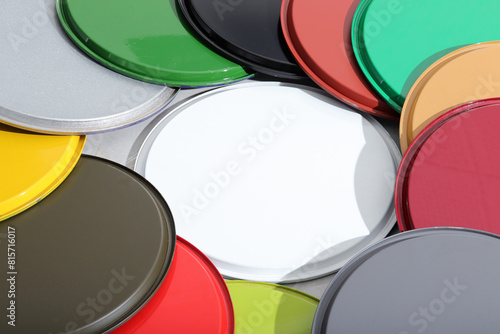 lids of colorful paint cans