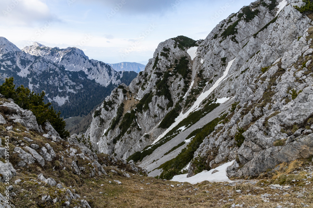 Fototapeta premium Begunjščica panorama of mountain trekking to the highest peak. View of the Alps, climbing with via ferrata. Distant view of Lake Bled from above. Sports holidays, life of adventure in the countryside