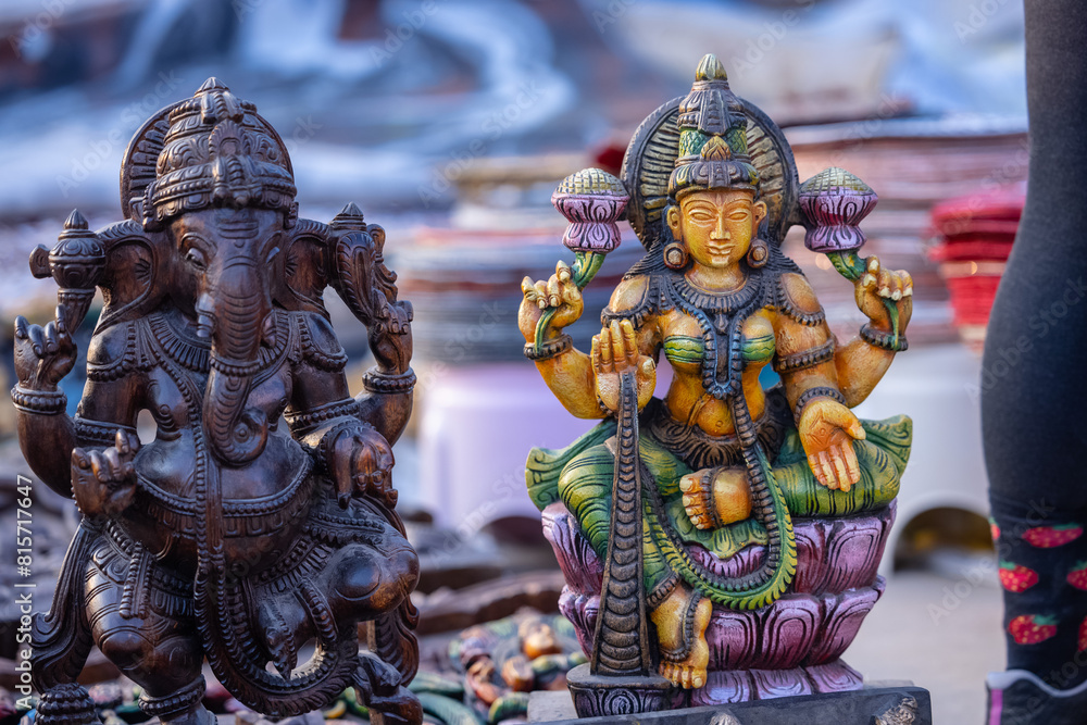 Fototapeta premium A handmade wooden idol of Lord Ganesh and goddess Laxmi sounds like a beautiful tribute to the deity's revered presence in Hindu mythology and culture. 