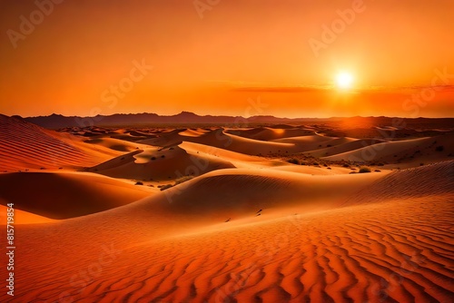 A surreal desert landscape at twilight  with the dunes aglow in a spectrum of warm colors as the last rays of the sun dip below the horizon