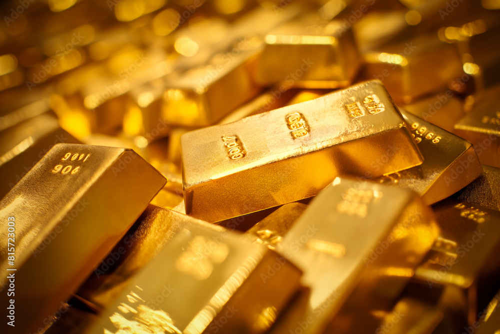 A pile of gold bars bullions close up A pile of gold bars bullions close up
