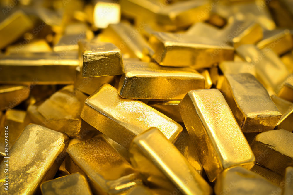 A pile of gold bars bullions close up A pile of gold bars bullions close up