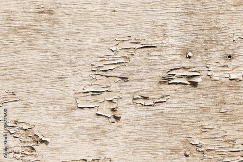 Vintage old cracked paint on a wooden surface, background texture of an aging grunge surface