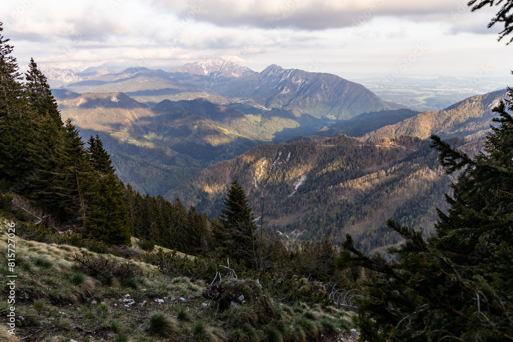 Obraz premium Begunjščica panorama of mountain trekking to the highest peak. View of the Alps, climbing with via ferrata. Distant view of Lake Bled from above. Sports holidays, life of adventure in the countryside