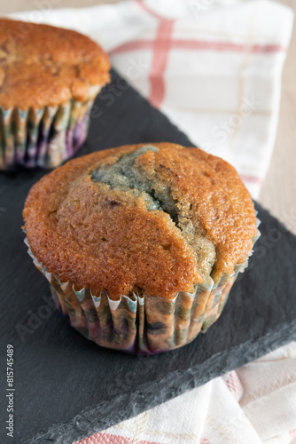 Delicious homemade blueberry muffin rustic background