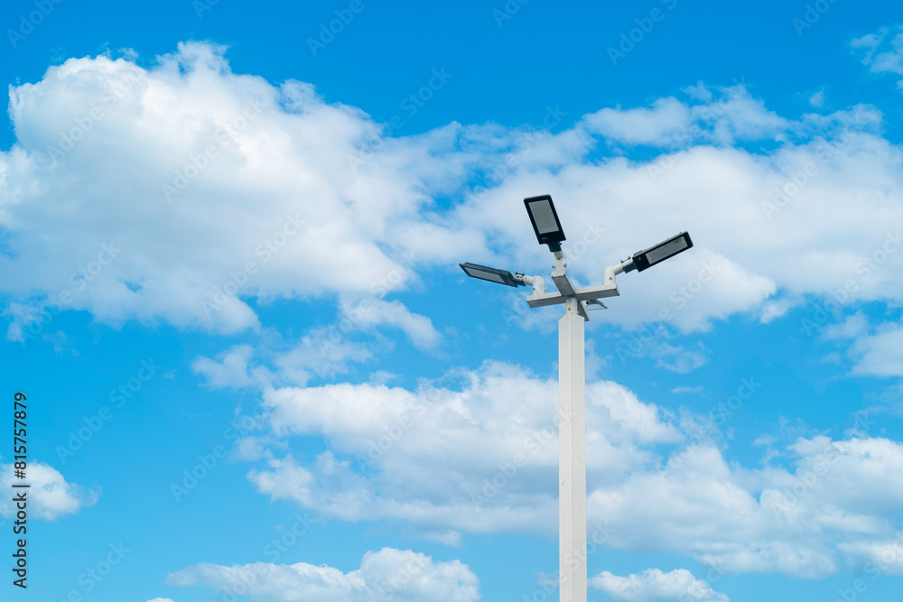 LED street lamp post, Ambient lighting pole with bright blue sky cloud daylight background. LED street lamp post, Ambient lighting pole with bright blue sky cloud daylight background.
