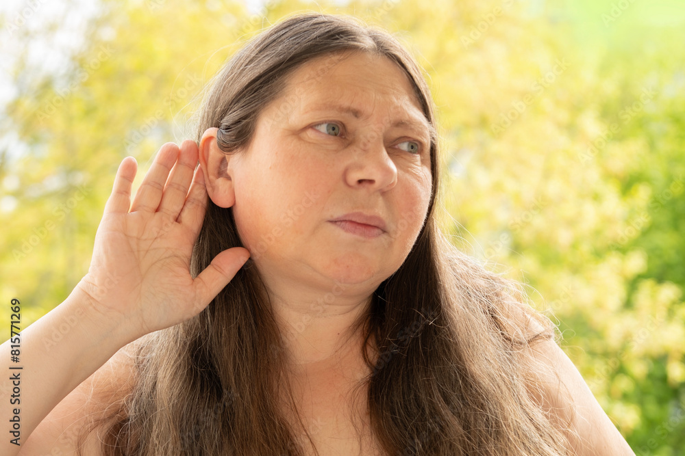 caucasian mature woman difficulty hearing, cerumen impaction, hearing loss, medical concept, loud sounds, middle ear inflammation, ototoxic medicines caucasian mature woman difficulty hearing, cerumen impaction, hearing loss, medical concept, loud sounds, middle ear inflammation, ototoxic medicines