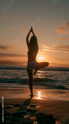A young woman practicing yoga on the sandy beach as the sun sets in the background  casting a warm glow over the scene. She performs various yoga poses.