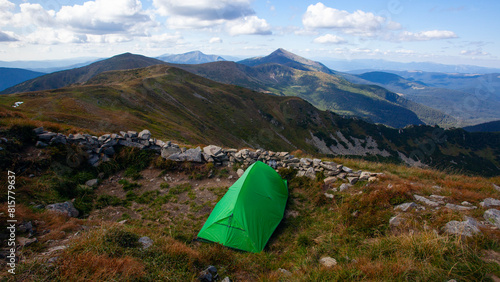 Green tent near Shpytsi with Hoverla view, Carathian mountains, Ukraine photo