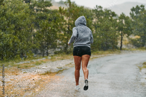 Unstoppable: A Determined Athlete Trains Through the Rain in Pursuit of Marathon Glory © .shock