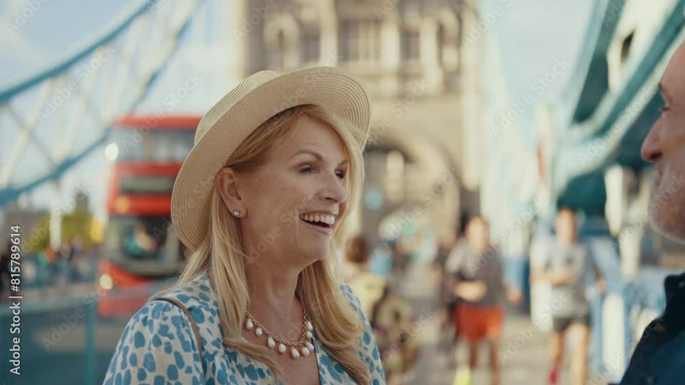 Happy senior couple spending time together in London city. Beautiful woman and man hugging on the tower bridge. Concepts about seniority, lifestyle and travel Happy senior couple spending time together in London city. Beautiful woman and man hugging on the tower bridge. Concepts about seniority, lifestyle and travel