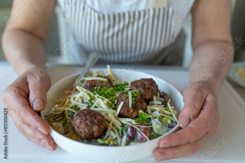 Fresh summer salad with mediterranean meatballs and cheese
