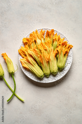 Group of zucchini flower on delicate pastel background. Top view.