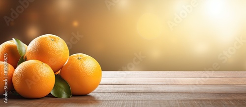 Close up of fresh oranges on a wooden table creating a detoxifying image with copy space