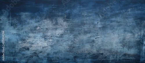 A high resolution copy space image featuring a rich dark blue background with a high quality texture