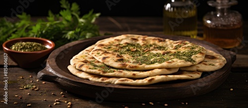 Zaatar Manaqish a traditional Middle Eastern dish is a type of flatbread topped with a flavorful blend of herbs spices and olive oil It is commonly enjoyed for breakfast or as a snack The dish is oft photo