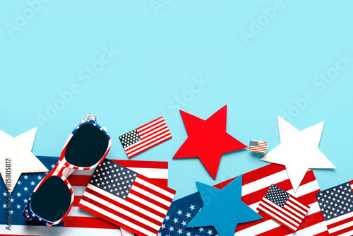 Happy Independence day July 4th. Top view of USA flag sunglasses, american flags and stars with copy space for text