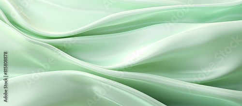 Elegant light green silk fabric with wavy patterns creates a beautiful and luxurious abstract background design Perfect for cards or banners Copy space image