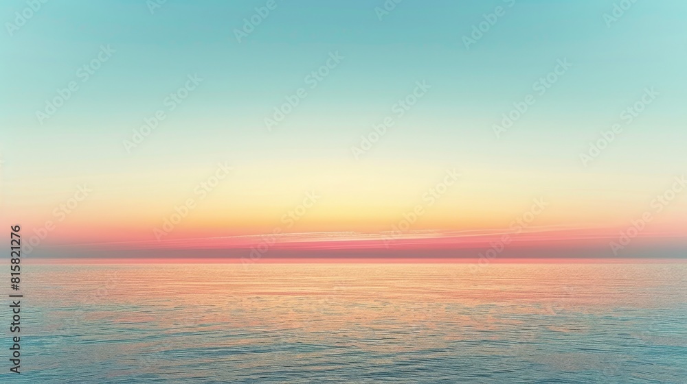 Tranquil ocean at sunset with a clear blue sky.
