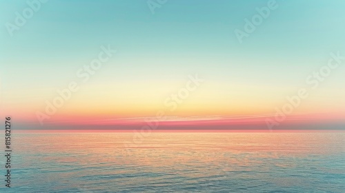 Tranquil ocean at sunset with a clear blue sky. © Glory