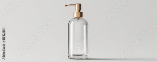 Mockup of a clear glass pump bottle with a gold pump, isolated on a white background, emphasizing the elegance for cosmetic products