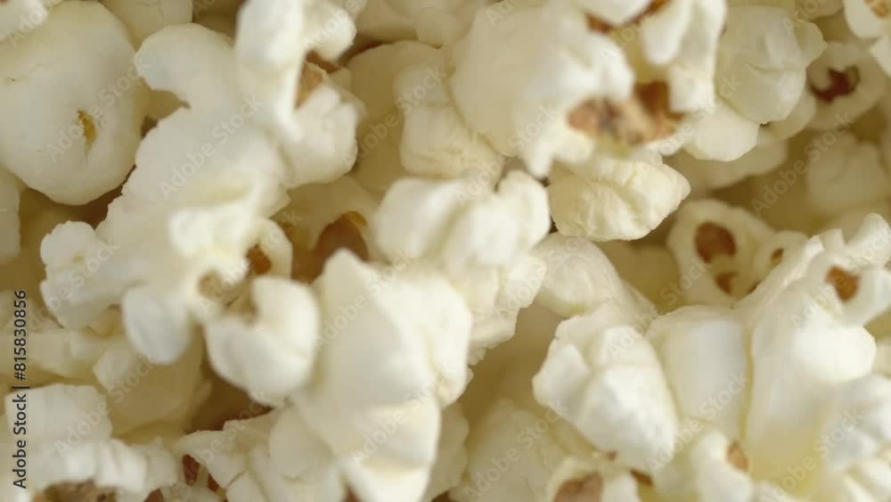 Fresh popcorn closeup rotating. Pop corn background. Macro footage of sweet popcorn Fresh popcorn closeup rotating. Pop corn background. Macro footage of sweet popcorn