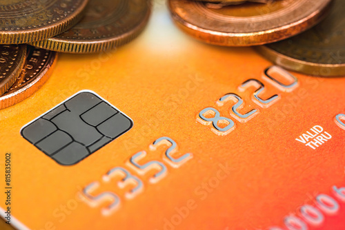 Credit Card and Coins macro photo. Cashless Currency Concept