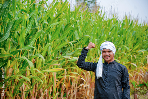 In a cornfield, a young Indian farmer