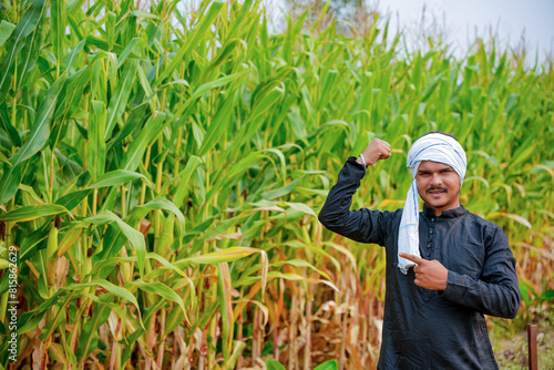 In a cornfield, a young Indian farmer