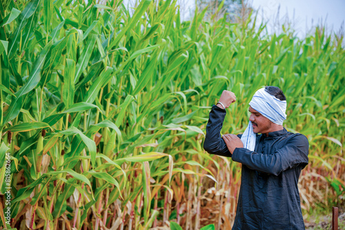 In a cornfield, a young Indian farmer