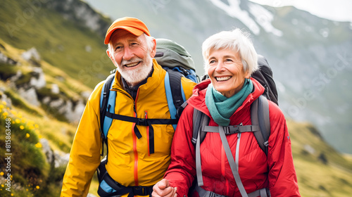 A serene elderly couple is hiking through the rugged mountains  surrounded by towering peaks and lush greenery  showing strength  love  and determination