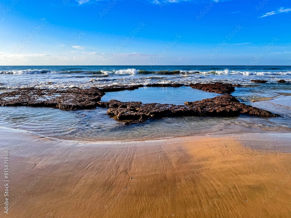 Portimao, Alvor coast, Portugal, Algarve. Rocks, rocky shore, yellow rocks, coquina, beautiful coastline Portimao, Alvor coast, Portugal, Algarve. Rocks, rocky shore, yellow rocks, coquina, beautiful coastline