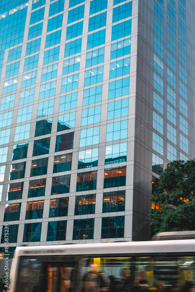Bus passing by a building, Street Photography at Paulista Avenue, São Paulo, Brazil. Bus passing by a building, Street Photography at Paulista Avenue, São Paulo, Brazil.