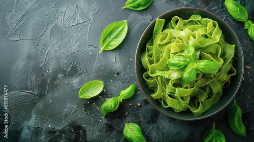 Alternative green spinach or pea fettuccine pasta with fresh basil leaves and pepper. Option for for use  culinary  healthy eating  fitness  diets. Copy space.