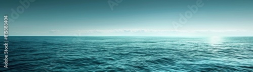 The image shows a beautiful seascape with a calm sea and a clear blue sky.