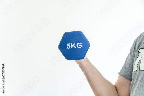 Arm lifting a dumbbell against a plain white background