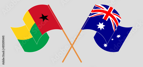 Crossed and waving flags of Guinea-Bissau and Australia